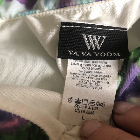 This is a floral jumpsuit with a scarf attached to the top of it on one side. - Picture 7 of 7